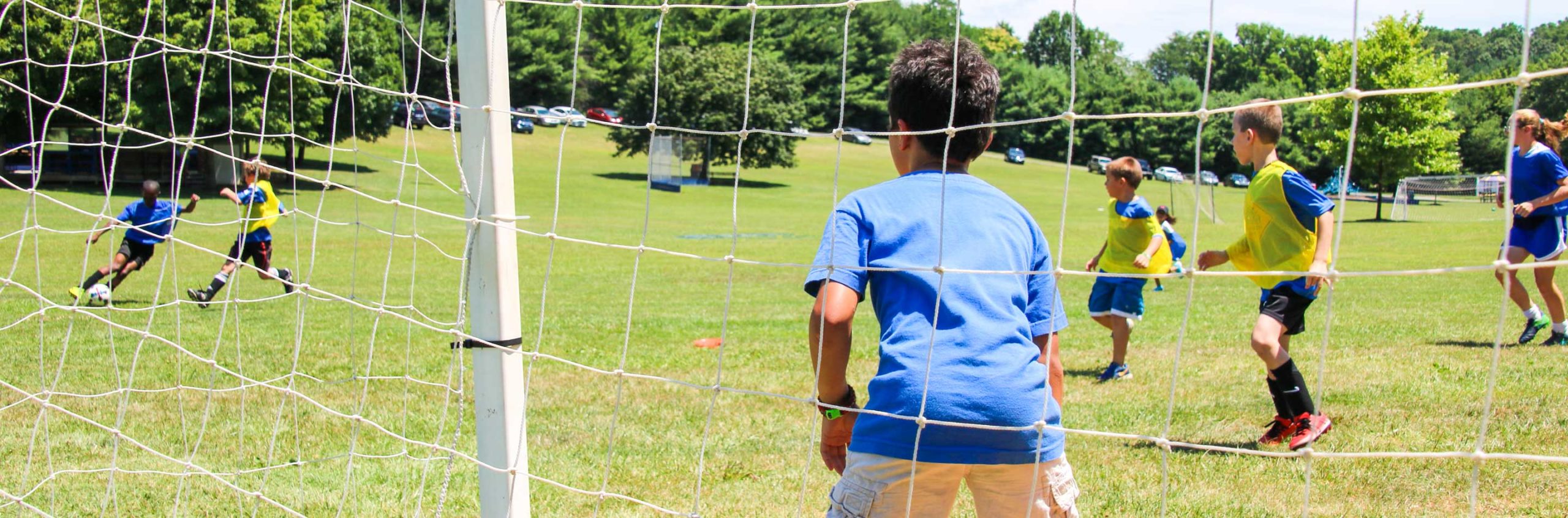 Boy playing soccer goalie during a soccer match